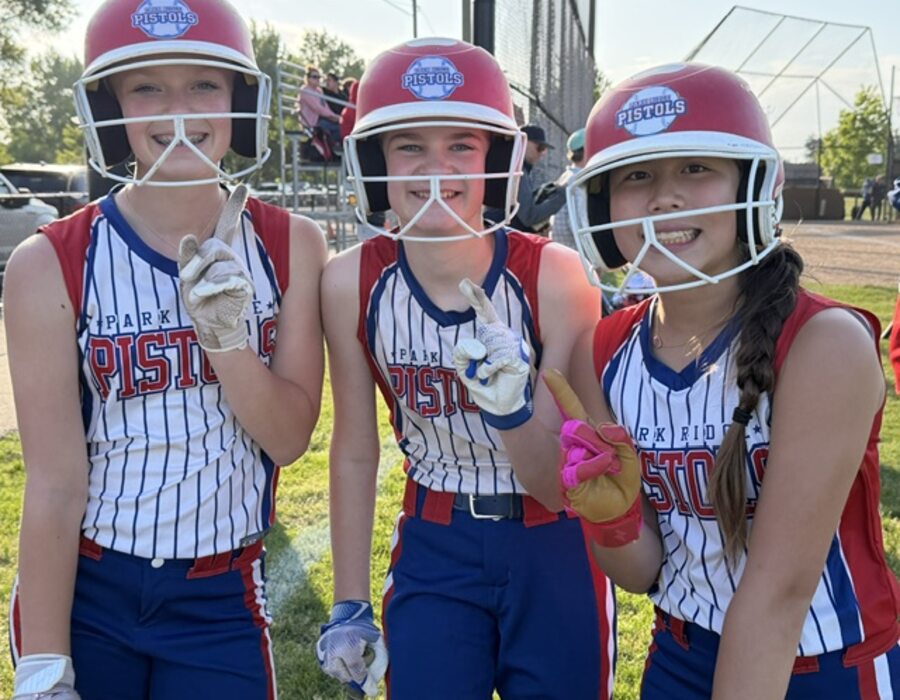 Three Pistols players in helmets before an at bat