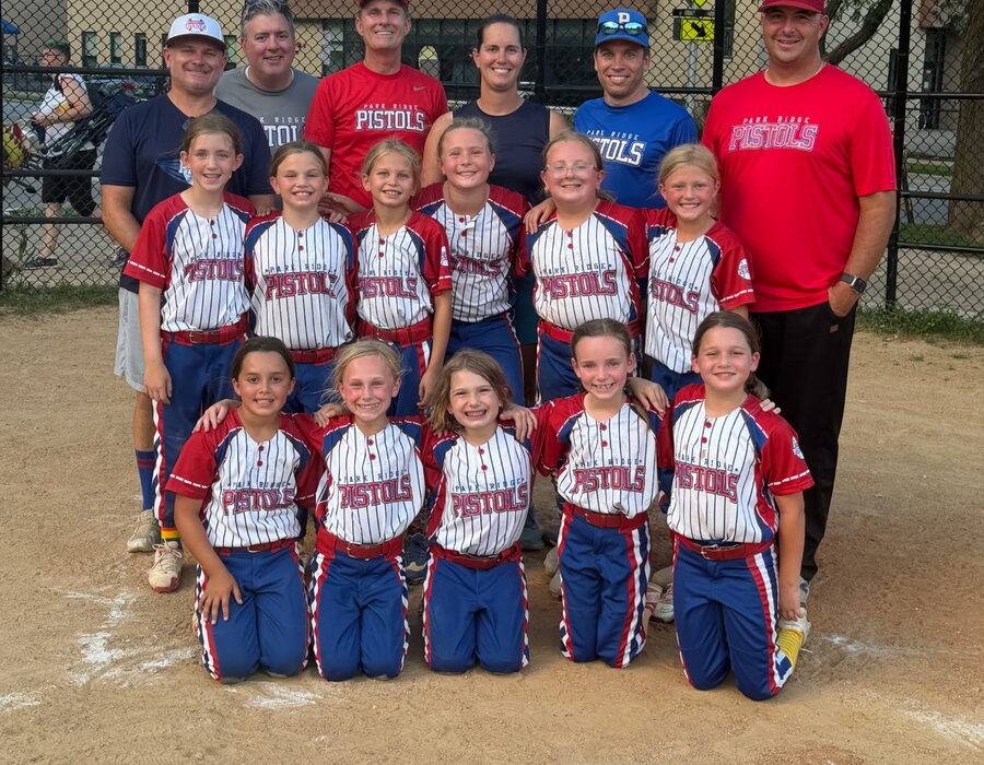 A Pistols team with their coaches after a game