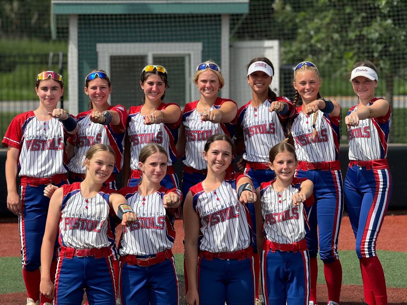 A Park Ridge Pistols team showing off their championship rings