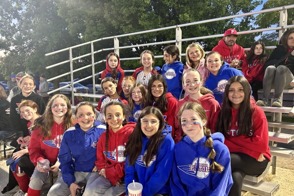 Pistols players together in the bleachers on opening night