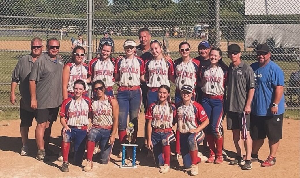 The Park Ridge Pistols 18U team with the trophy from their final tournament